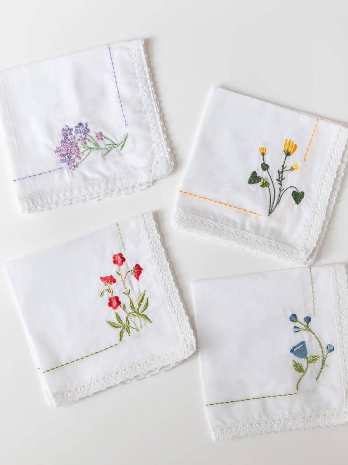 Bouquet Corners handkerchief with floral corner embroidery and lace edging
