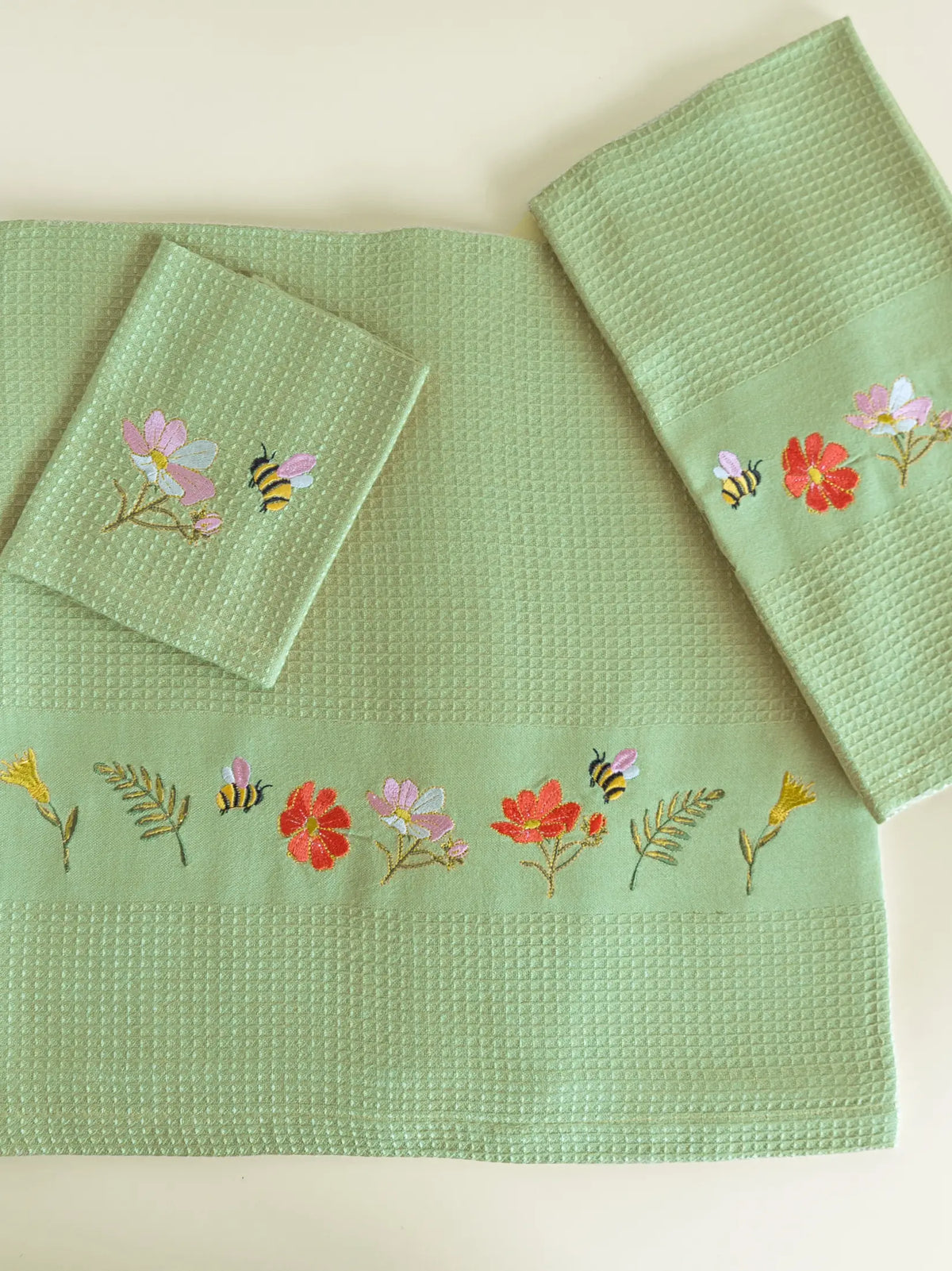 Olive green waffle bath, hand and face towels with bees and colourful garden flower embroidery
