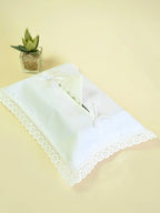 White tissue box cover with lace trim and two ribbon bows