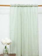 White sheer curtain with a fine green grid pattern and gathered rod pocket