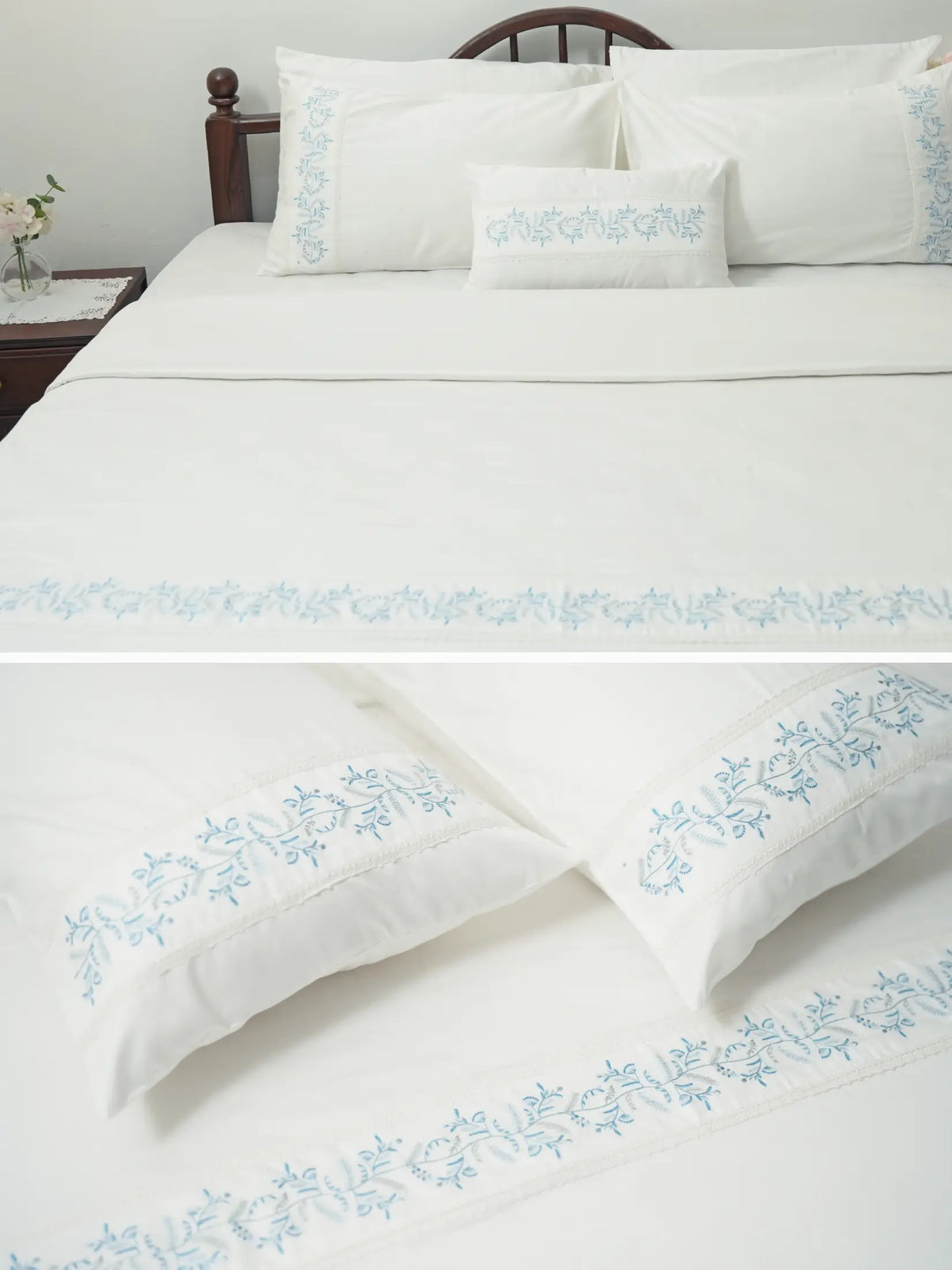 Composite view of white bed linen and pillowcases with blue vine embroidered borders